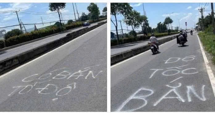 Dòng chữ "bắn tốc độ" được xịt trên đường.